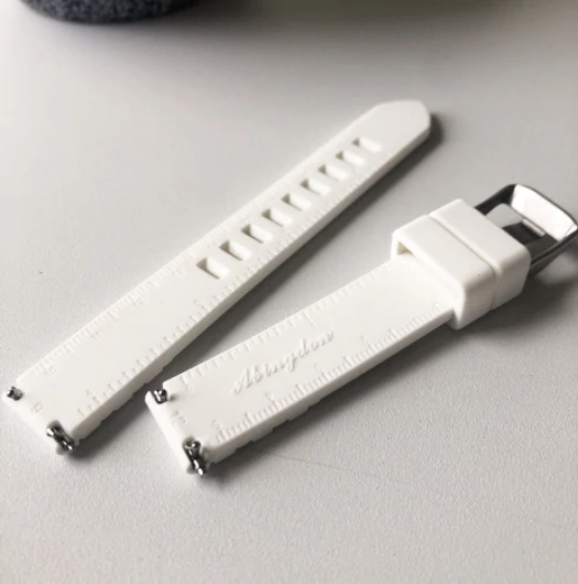 Abingdon Co. A image displaying  silicone strap laying on a white table top