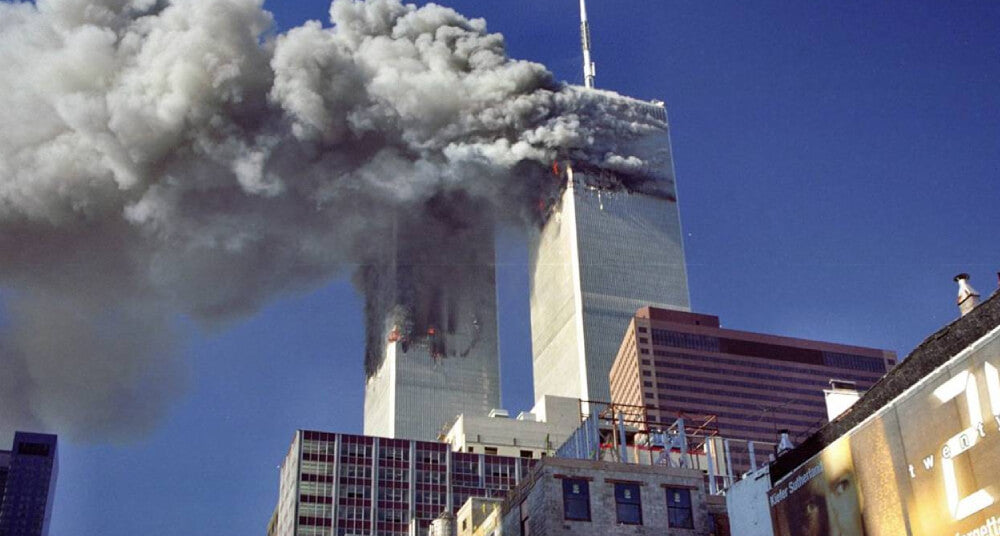 Photo of twin towers being attacked on September 11, 2001 by Cyril A. hosted on flikr CC BY-NC-ND 2.0