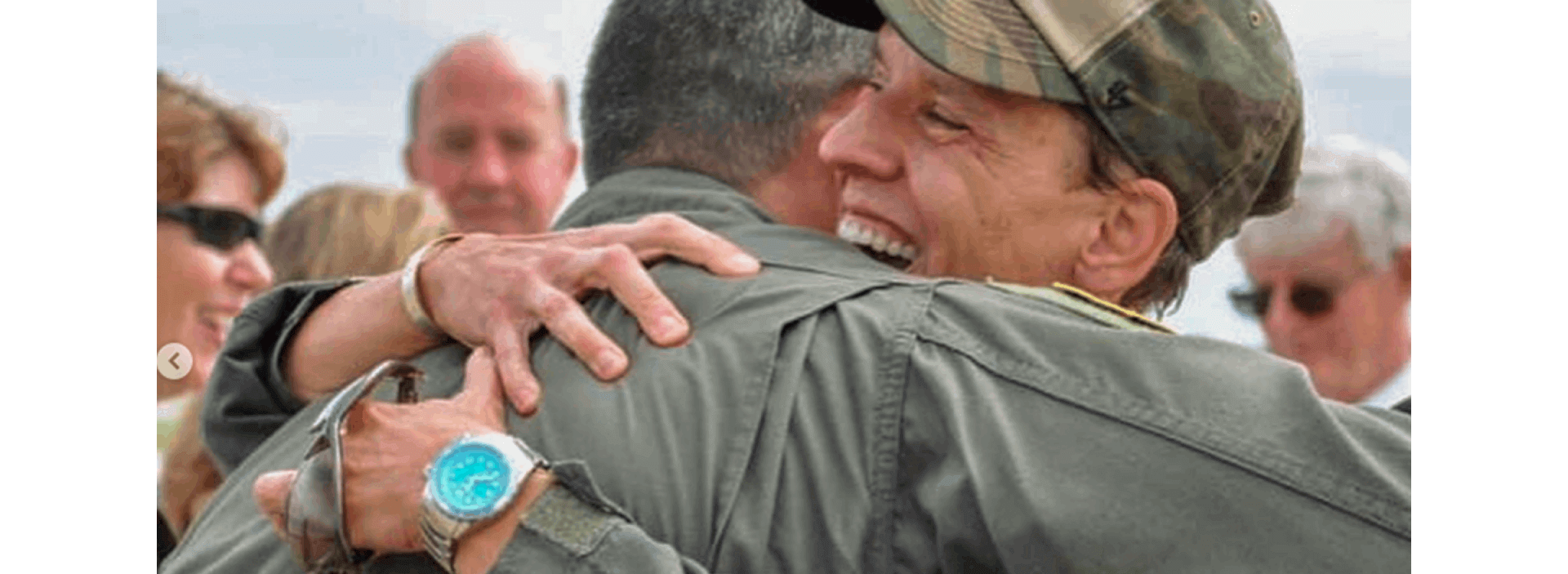 Abingdon Co. Image displays Retired Air Force Colonel Laurel “Buff” Burkel embracing a fellow serviceman