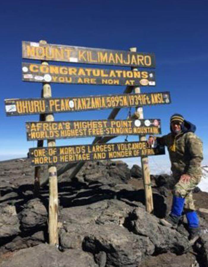 Abingdon Co. Image displaying ©2016 Retired Colonel Laurel “Buff” Burkel at the summit of Mt. Kilimanjaro