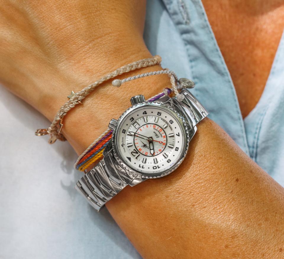 Abingdon Co Image circa 2023 displaying Elise in Athenian Silver on woman's wrist wearing a light blue shirt