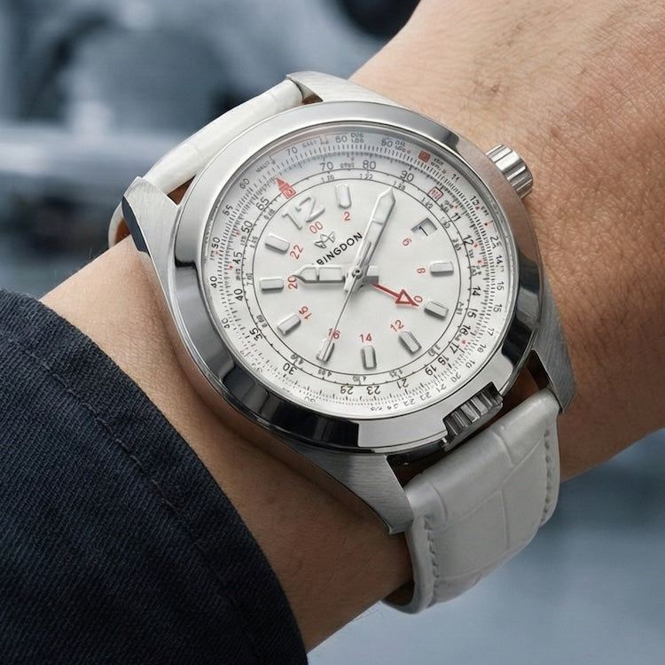 Silver Abingdon Co Amelia wristwatch with a detailed face on a wrist against a blurred background