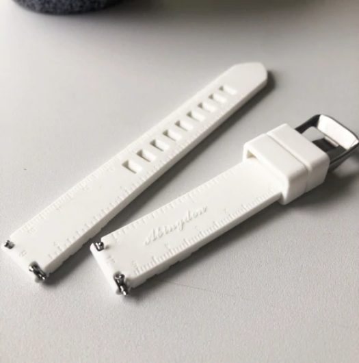 Abingdon Co. image displaying silicone strap laying on a white table top
