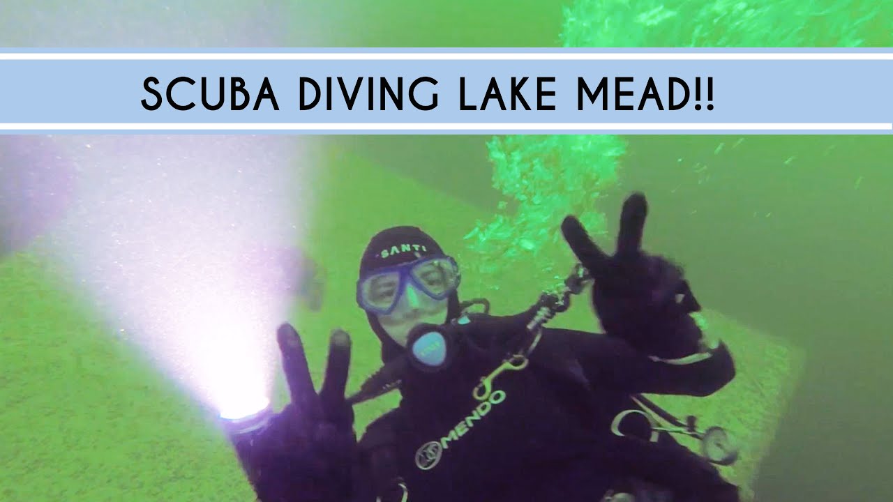 Abingdon Co. Image Displays a woman scuba diver making a piece sign under water