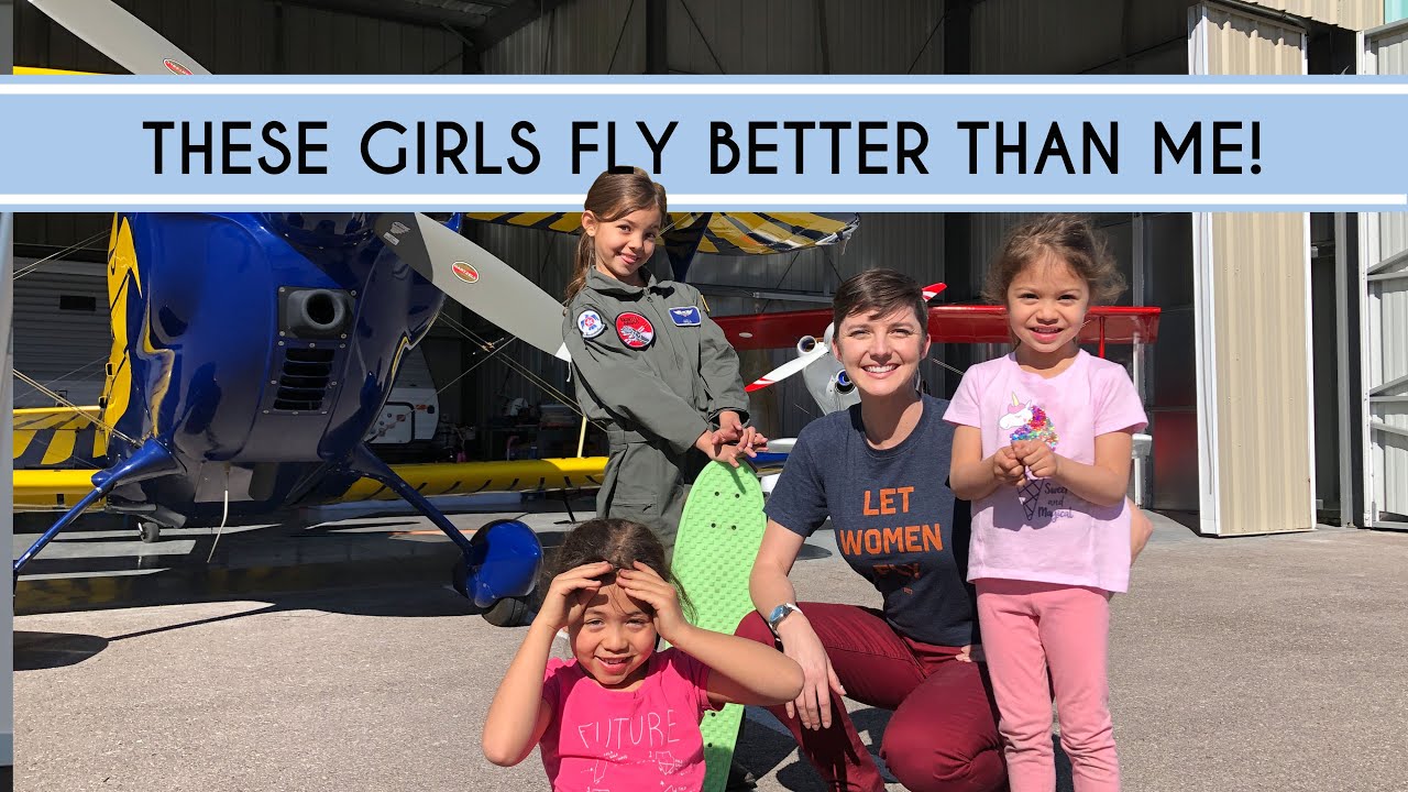 Abingdon Co. Image Displays Abingdon mullen with three little girls in an aircraft lot with an aircraft behind them all posing and smiling to the camera